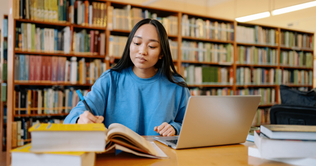 High school student completing college application to be considered for merit scholarships