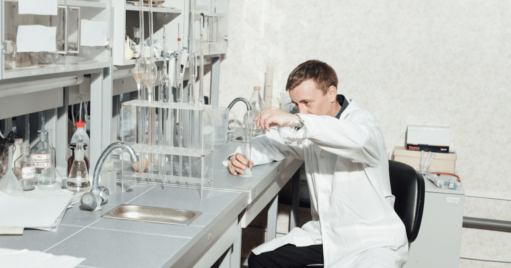 Pre-med college student working in a university chemistry laboratory