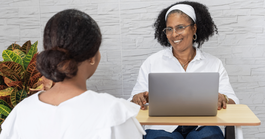 Pre-med student meeting with a college academic advisor on campus